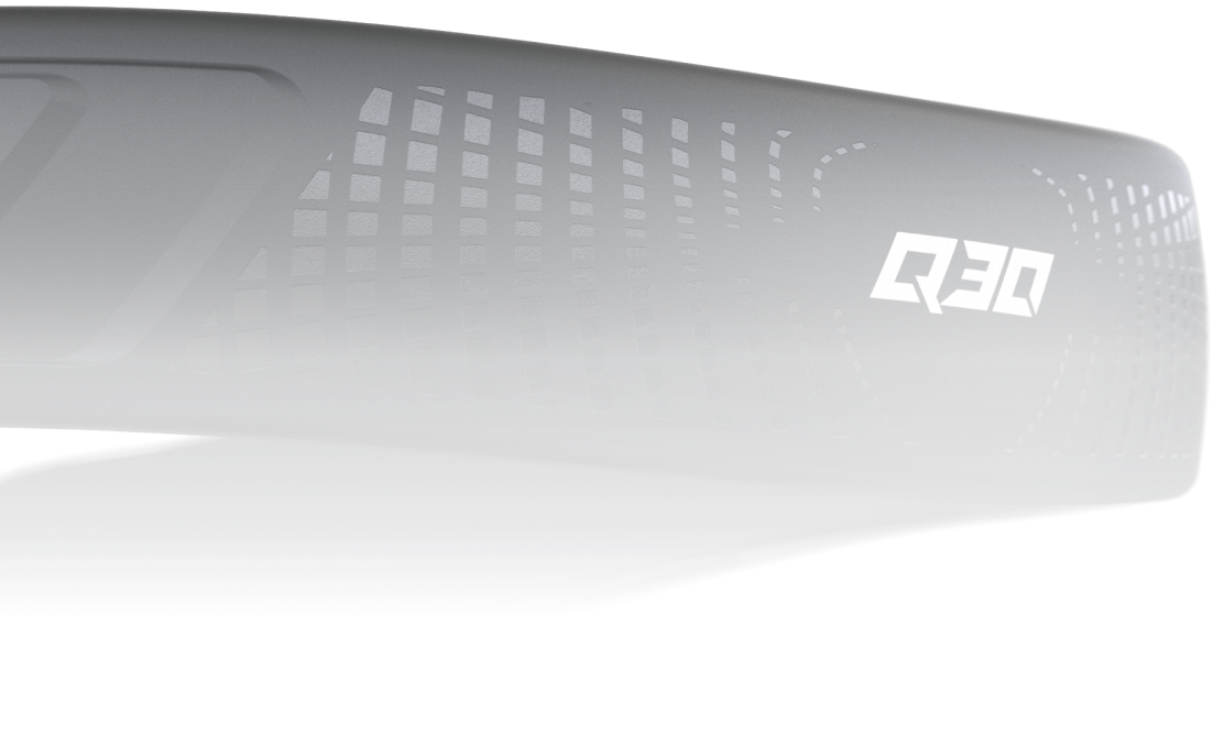 A close-up, horizontal studio shot of a matte black Q-Collar. The image highlights the texture of the band, featuring a glossy, geometric grid pattern on the side alongside a white, stylized "Q30" logo.
